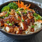 A close-up view of a colorful Chicken Teriyaki Meal Prep Bowl with rice, chicken, and vegetables.