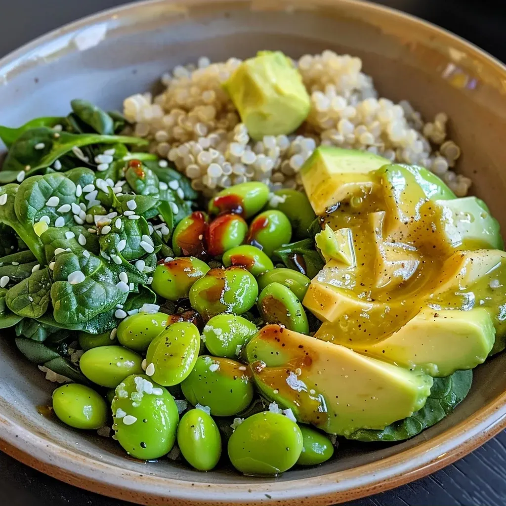 Side view showcasing a healthy Buddha Bowl filled with edamame, avocado, and spinach.