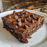 Close-up of moist cottage cheese brownies topped with chocolate chips.