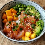 Close-up view of a vibrant Poke Bowl with salmon and colorful toppings.