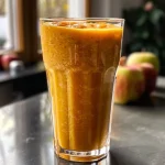 Close-up view of a warm winter smoothie featuring apple and cinnamon.